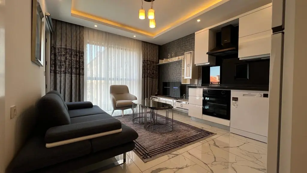 FURNISHED 1+1 FLAT IN A FULL FACILITY COMPLEX IN THE CENTER OF ALANYA